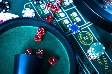 Close-up of a live baccarat table with dealer, cards, and betting layout
